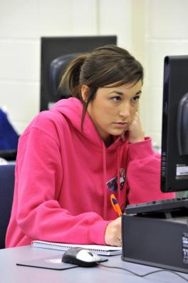 Girl studies on a computer