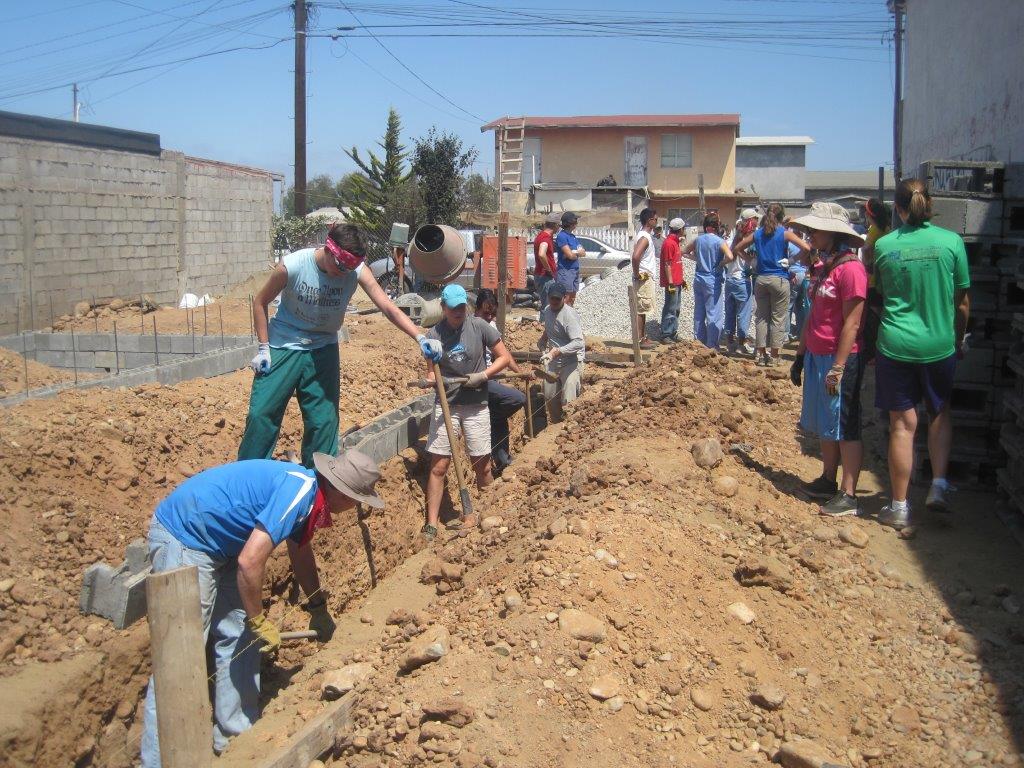 Volunteers helping to build sustainable housing